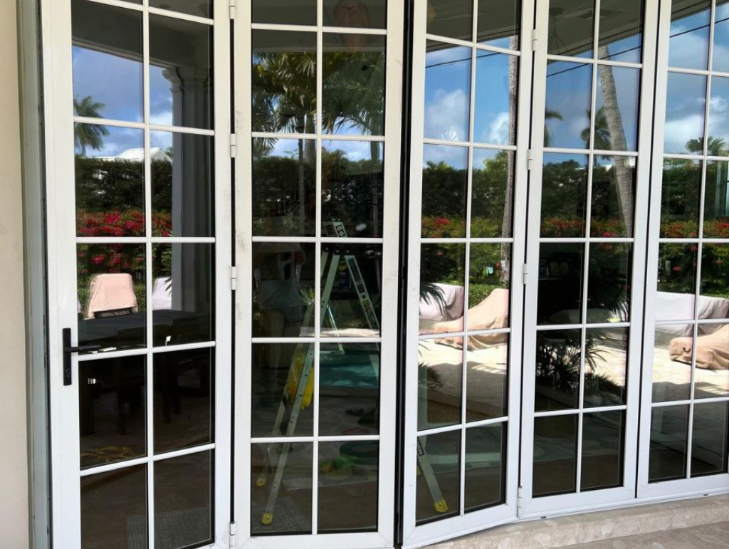 Technician inspecting impact glass frame on-site