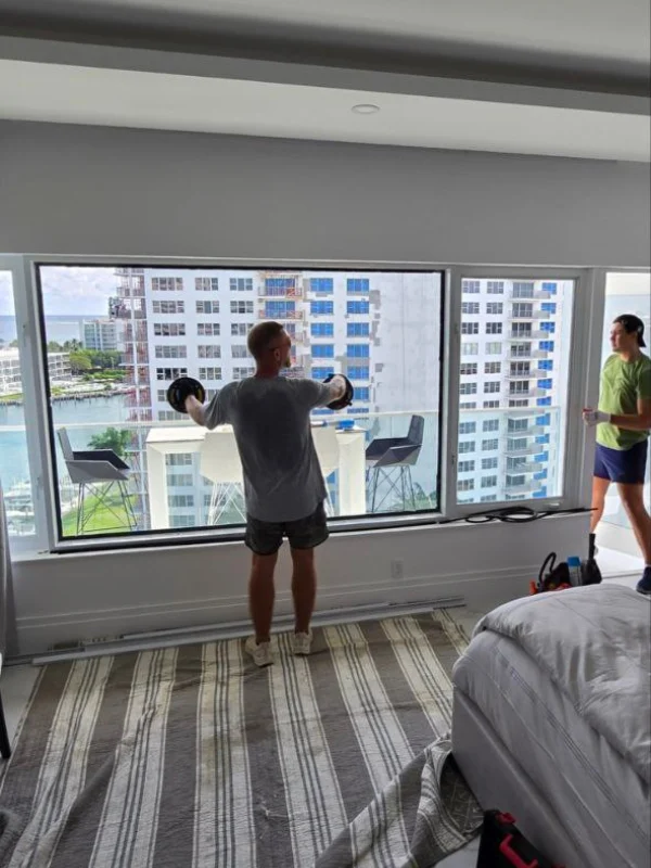 Window repair in progress in a waterfront bedroom