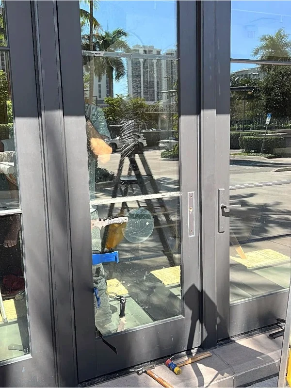 Glass door panel with protective film during installation